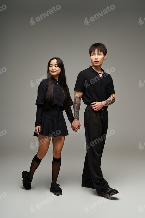 Preview: Stylish couple showcases love and fashion in an elegant studio setting