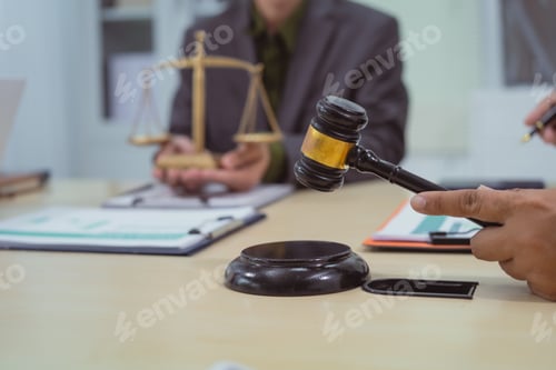 Preview: Three lawyers in a meeting at the table in an office, discussing business,civil and commercial law
