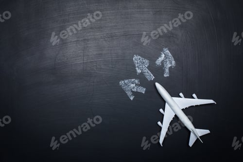 Preview: toy airplane over chalkboard background and arrows drawings