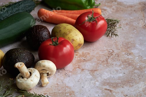 Preview: Fresh Vegetables and Mushrooms on a Light Brown Countertop