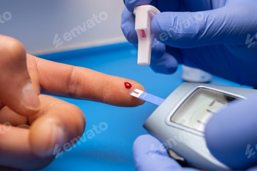 Preview: Closeup shot of a doctor with rubber gloves taking a blood test from a patient