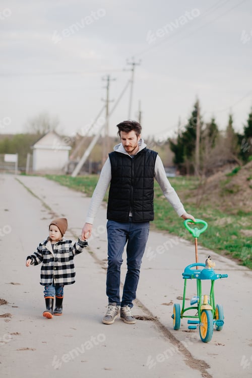 Preview: Dad is walking with his little daughter outside