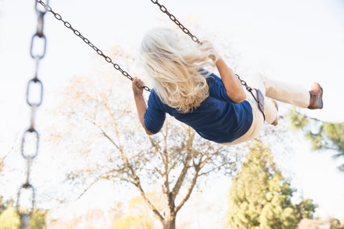 Preview: Senior woman playing swing, Hahn Park, Los Angeles, California, USA