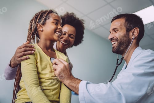 Preview: Doctor examines a child with stethoscope in examination room. Healthcare people children concept