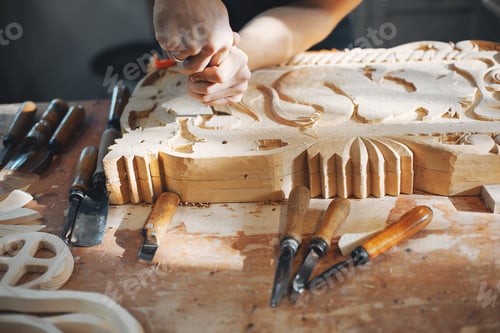 Preview: The carpenter works with a tree
