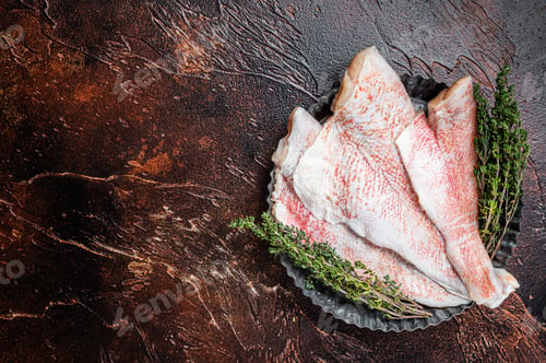 Preview: Raw ocean red perch fillet, Snapper fish with herbs. Dark background. Top view. Copy space