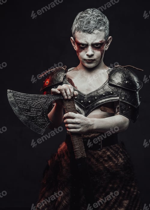 Preview: Holding an axe little barbarian with painted skin in dark background