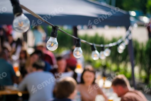 Preview: Hanged lamps at outdoor BBQ restaurant
