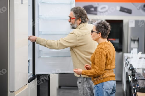 Preview: Senior couple shopping for new refrigerator in appliance store