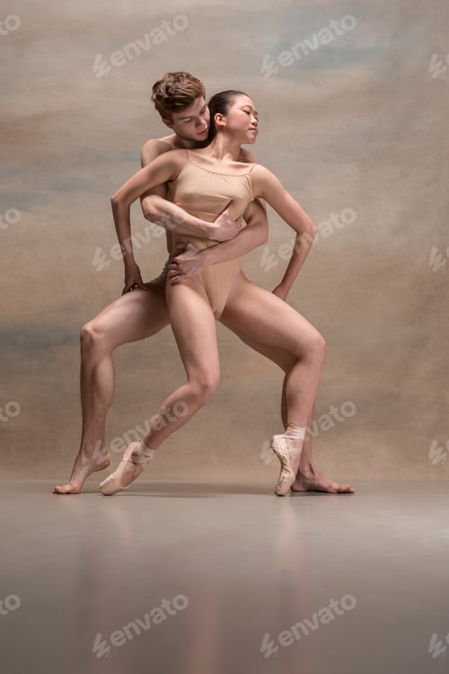 Preview: Couple Of Ballet Dancers Posing Over Gray Background