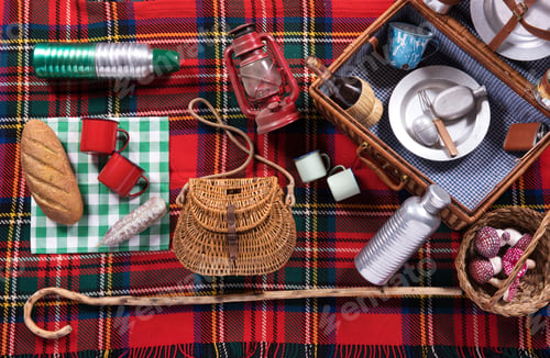 Preview: Assortment of picnic tools on a tartan rug