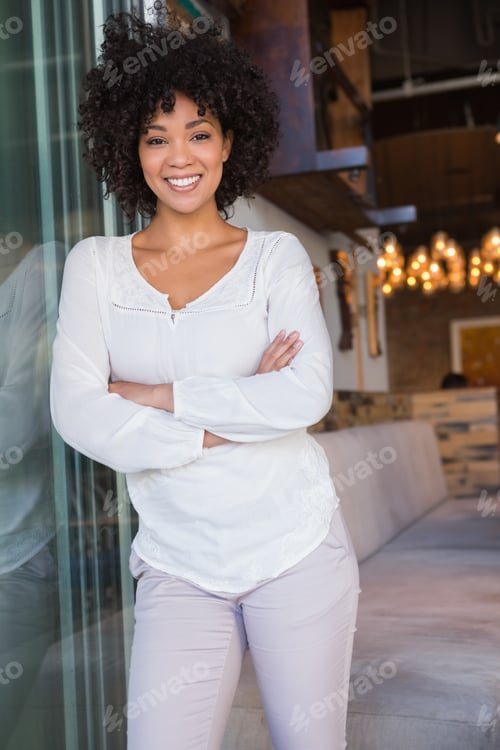 Preview: Beautiful worker posing with arms crossed at the bakery