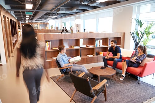 Preview: Casually Dressed Businessmen And Businesswomen Having Informal Meeting In Modern Office