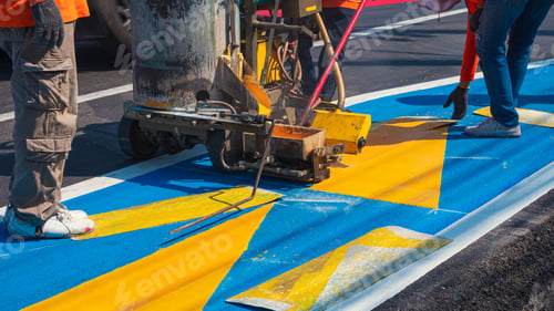 Preview: Road workers group with thermoplastic marking machine painting traffic lines and bike lane on street
