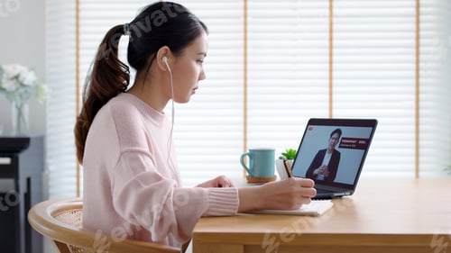 Preview: Back rear view young asian woman listen to virtual business conference webinar