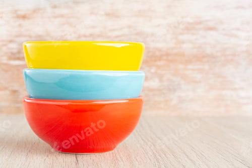 Preview: Ceramic bowl assorted colors on wooden background