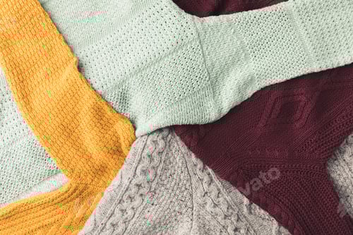 Preview: top view of warm knitted sweaters different colors