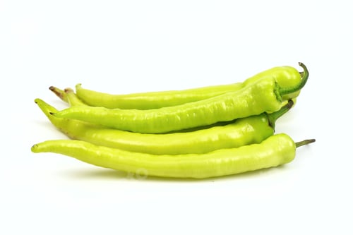 Preview: Stack of green chili peppers, on white background.