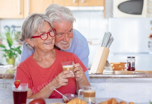 Preview: Senior Couple Embracing While Enjoying Morning Coffee