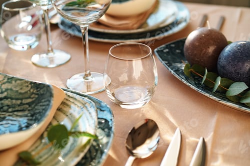Preview: Beautiful elegant table setting with green stylish dishware and silver cutlery