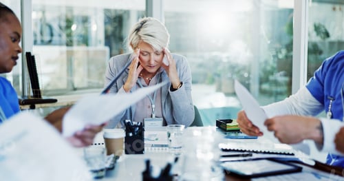 Preview: Frustrated woman, headache and meeting with documents for overworked stress or anxiety at hospital.