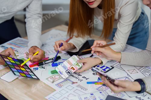 Preview: UI designer and UX developer brainstorm idea to design the application appearance in the early stage