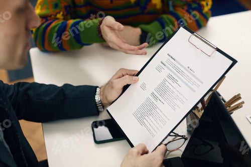 Preview: Businessman Discussing Contract At Meeting