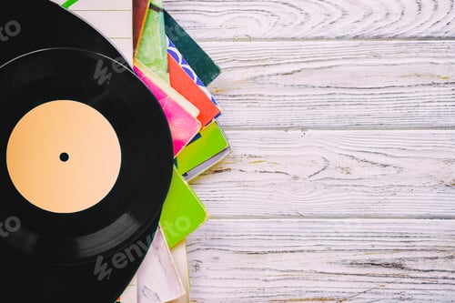 Preview: Retro styled image of a collection of old vinyl record lp's with sleeves