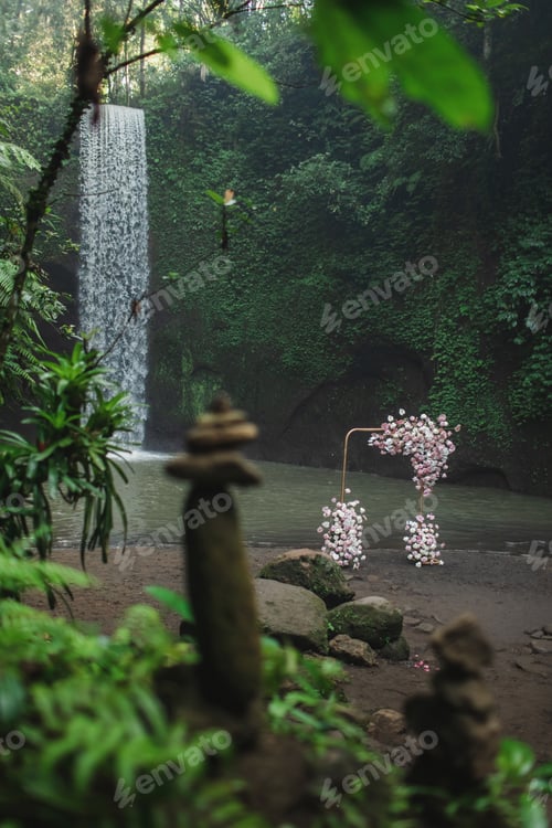 Preview: Metal square wedding arch decorated with pink and coral colored flowers anthurium, orchids