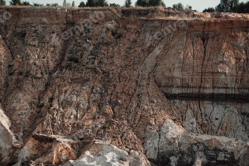 Preview: Canyon quarry cut of arid soil in the desert.
