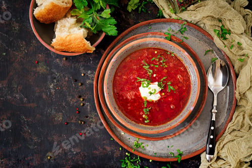 Preview: Traditional Ukrainian Russian borscht with beef on the bowl. Top view
