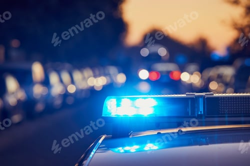 Preview: Siren light on roof of police car at night street. Themes crime, emergency and help.
