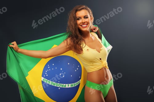 Preview: Happy Brazilian fan cheering with flag