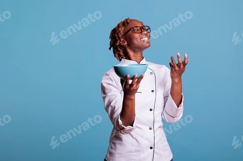 Preview: Female chef looking proud of new recipe
