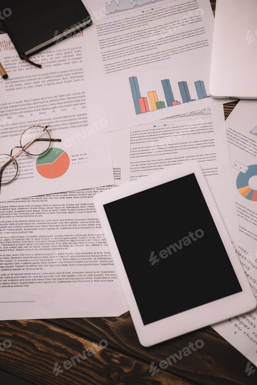 Preview: top view of digital tablet with blank screen and business documents