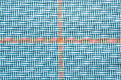 Preview: Abstract Texture Of Textile Checkered Fabric Of White And Blue Color With Orange Cross