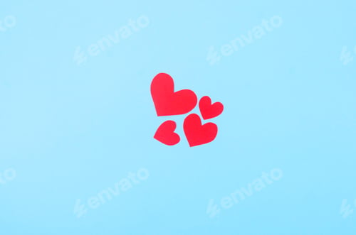 Preview: Red paper hearts on a blue background. Concept of the St. Valentine's day,