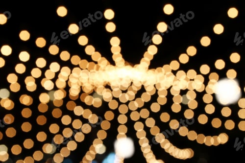 Preview: Blurred lines from circles golden and white colors on a black background.