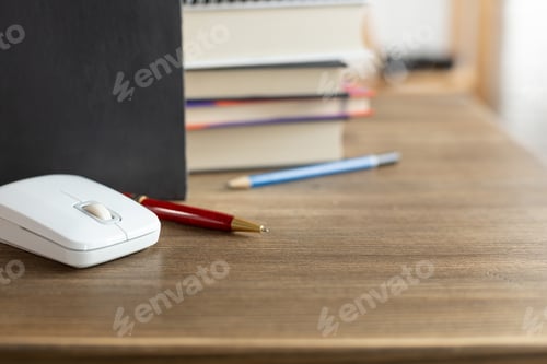 Preview: Chalkboard and school supplies on table. Student home workplace