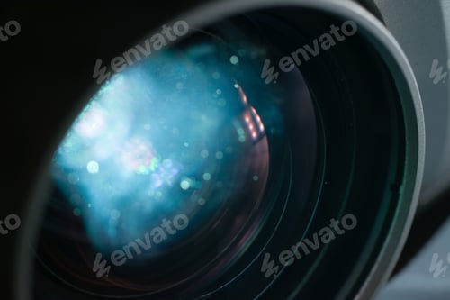 Preview: Closeup shot of a projector lens with a blue sparkly reflection-perfect for wallpapers