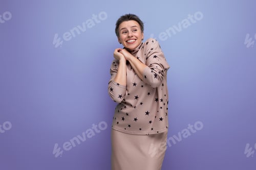 Preview: young grey-haired European woman with a short haircut dressed in a blouse and skirt