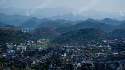 Preview: Village in Guiyang China with hill forests and haze in the background
