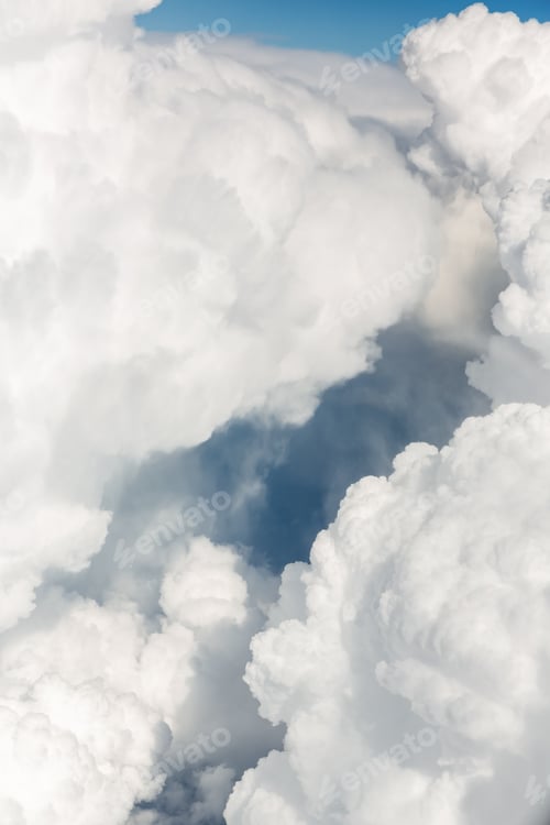Preview: Fluffy white clouds, a view from airplane window