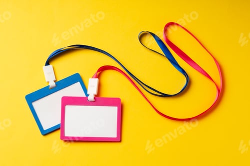 Preview: Colored blank nametags on strings on yellow background