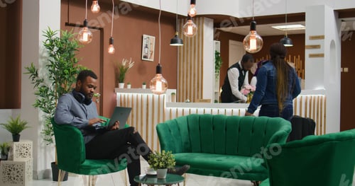 Preview: Traveller browsing social media at hotel