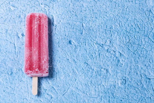Preview: Strawberry popsicles on blue background