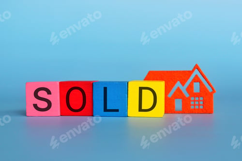 Preview: Miniature house and wooden cubes with text SOLD.
