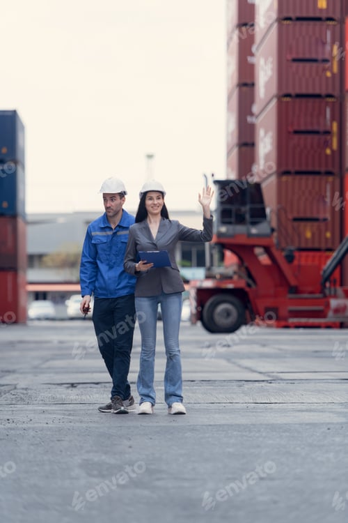 Preview: Container manufacturing manager and businesswomen survey the area to plan the storage