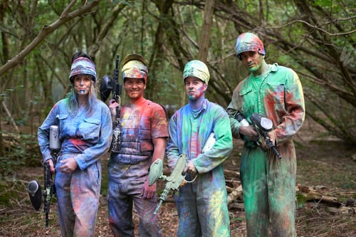 Preview: Paintball players in paintball wear marked with paint