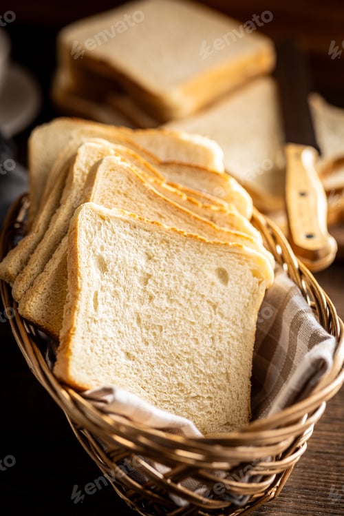 Preview: White sliced toast bread on wooden table.